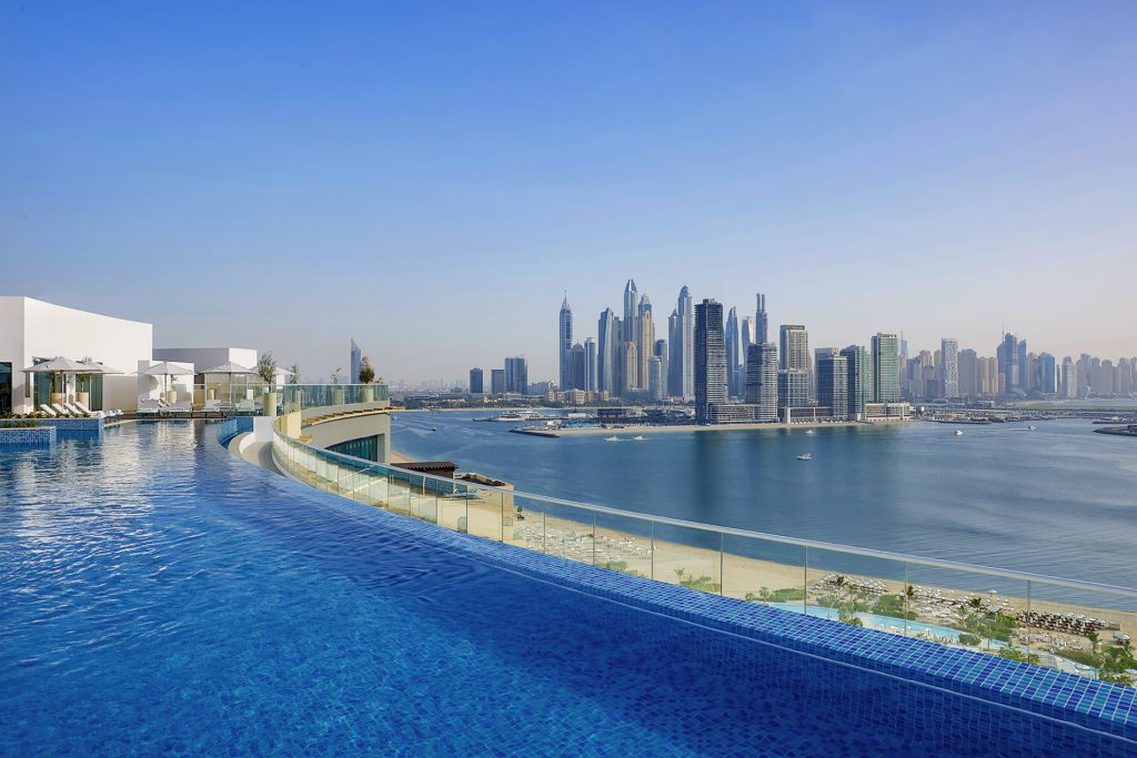 NH-Collection-Dubai-The-Palm-pool-with-beach-and-skyline-view